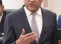 Justice Minister denies relative holds diplomatic passport