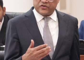 Justice Minister denies relative holds diplomatic passport