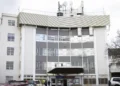 Man charged after walking into hospital with a gun