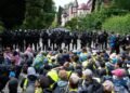 Far-right German party re-elects leaders as protesters and police clash
