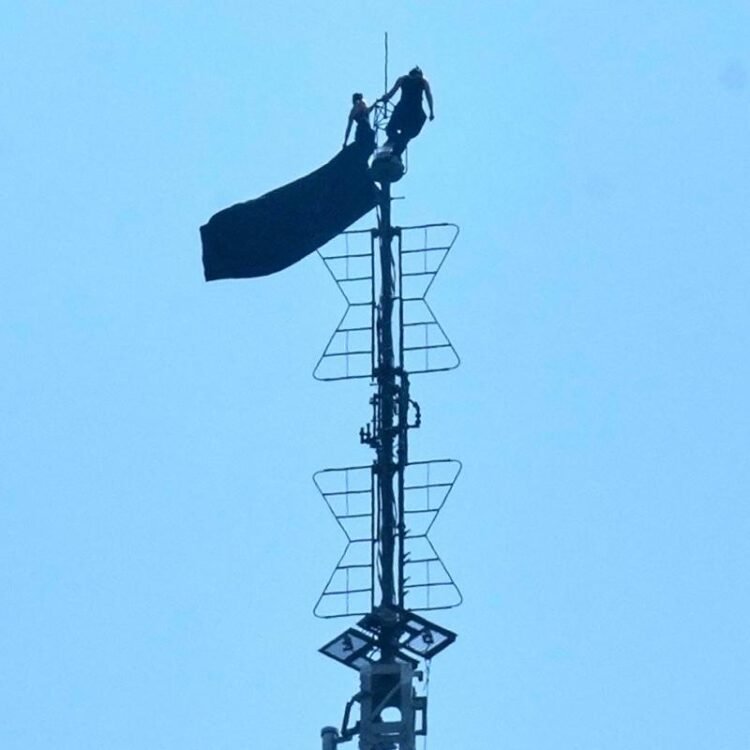 Two persons climb to top of Empire State Building antenna to hang banner about ‘the power of love’ | World News