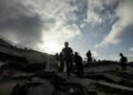 The search for life continues despite the smell of death in the rubble of La Guaira