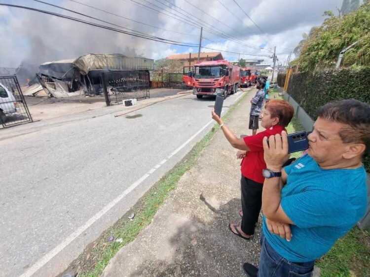 Fire destroys supermarket, leaves seven homeless