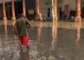 Havana: Rain and clogged sewers form a dirty river