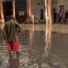 Havana: Rain and clogged sewers form a dirty river