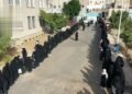 A massive women’s stand in the capital under the slogan “Preparedness and mobilization to lift the aggression and siege”