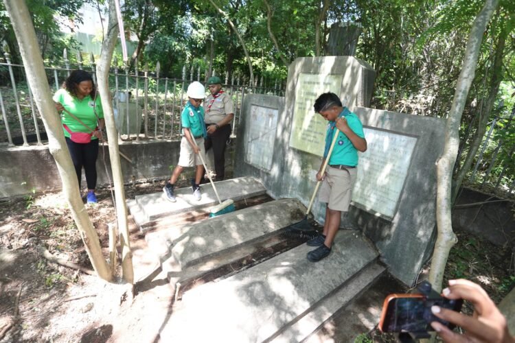 Scouts spend Emancipation Day cleaning Sir Lamont family graves,