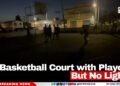 A Basketball Court with Players But No Lights
