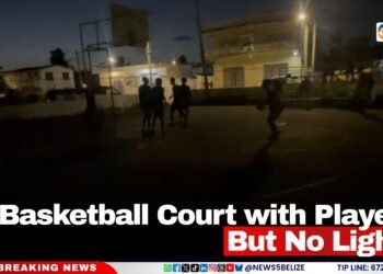 A Basketball Court with Players But No Lights