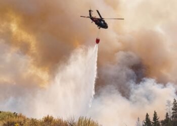Evacuations as wildfire nears US city