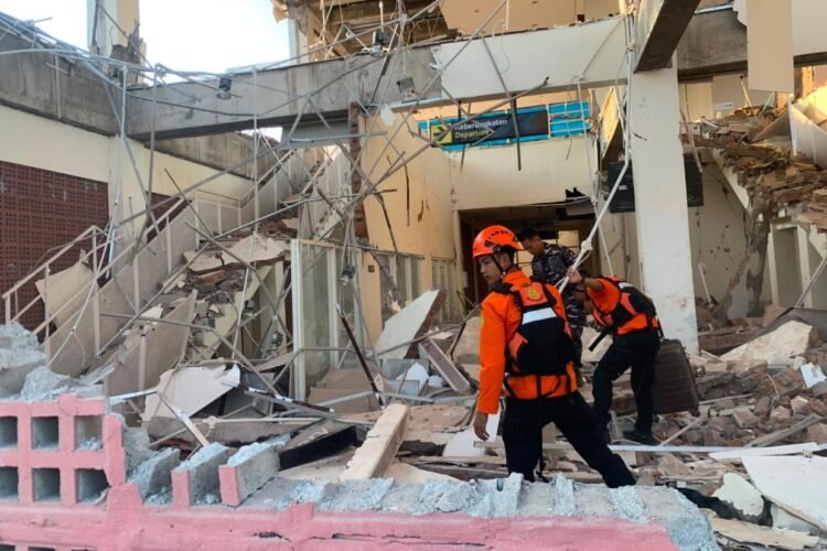 Rescuers dig through rubble and landslides after Indonesia quake kills 53