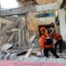 Rescuers dig through rubble and landslides after Indonesia quake kills 53