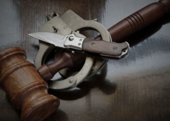 Man warned after chasing neighbour with knife