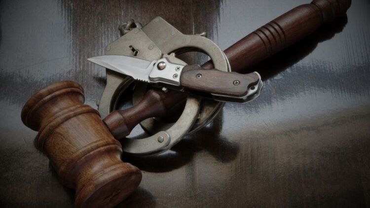 Man warned after chasing neighbour with knife