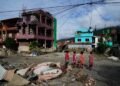 Rescuers race to find survivors after Himalayan floods kill at least 350