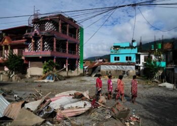 Rescuers race to find survivors after Himalayan floods kill at least 350
