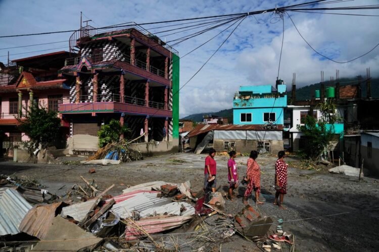 Rescuers race to find survivors after Himalayan floods kill at least 350