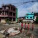 Rescuers race to find survivors after Himalayan floods kill at least 350