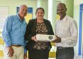 SVG EX Teachers present movie projector to J.P Eustace Memorial