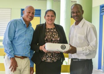 SVG EX Teachers present movie projector to J.P Eustace Memorial