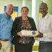 SVG EX Teachers present movie projector to J.P Eustace Memorial