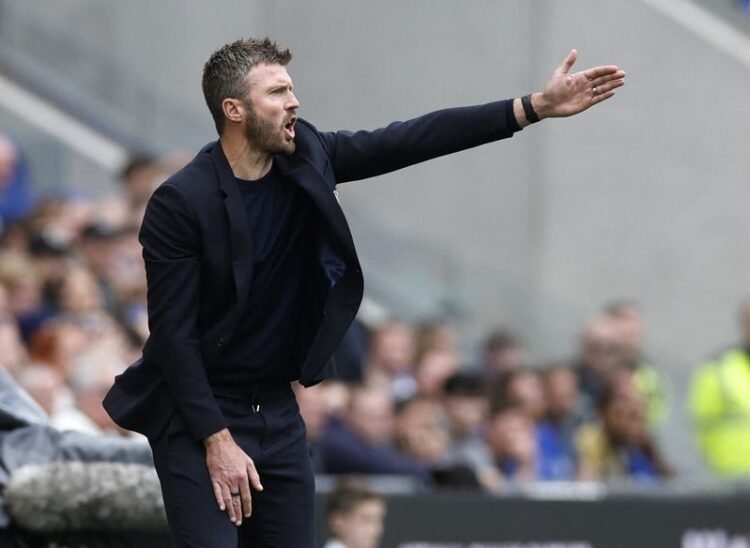 Football: Soccer-Carrick hurt by stoppage-time blow in Man United draw at Everton