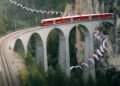 Swiss paraglider flies around viaduct in stunning stunt