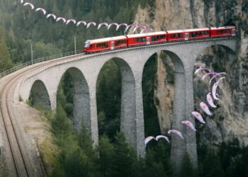Swiss paraglider flies around viaduct in stunning stunt