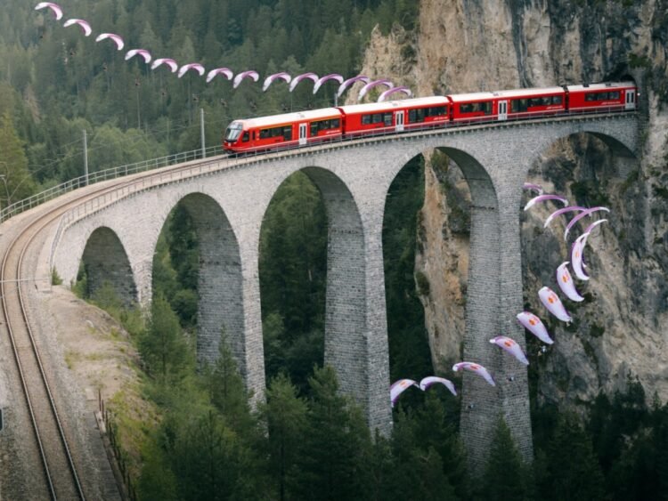 Swiss paraglider flies around viaduct in stunning stunt