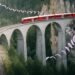Swiss paraglider flies around viaduct in stunning stunt