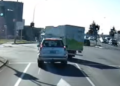 Dashcam shows company truck cutting through traffic at intersection