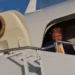 Trump emerges from Air Force One … wait a minute, his hair is brown!