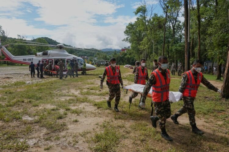 Symbolic funerals held in Nepal for those feared lost as some missing tourists make contact