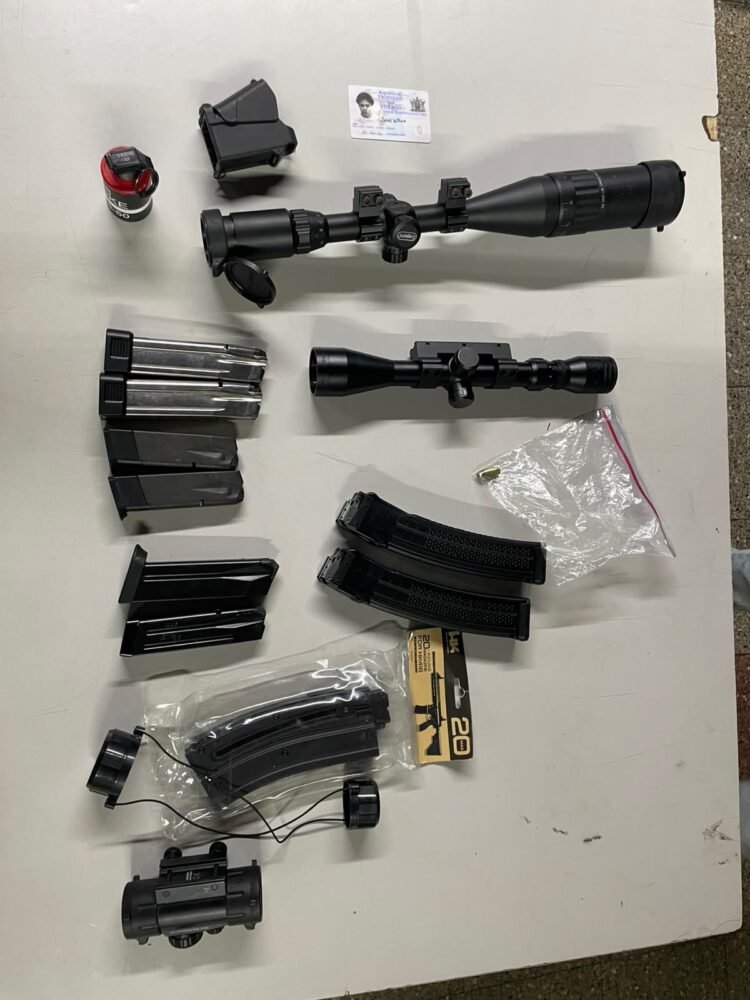 La Romaine man arrested as firearm magazines and scopes seized
