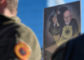 Banner of a protesting citizen: Chief Justice Charles Smith under the silhouette of Albin Kurti, with EU hammer in hand