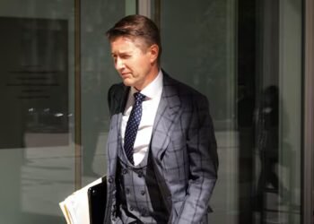High-flying lawyer goes on trial for writing bad cheque allegedly to cover for collapsing firm