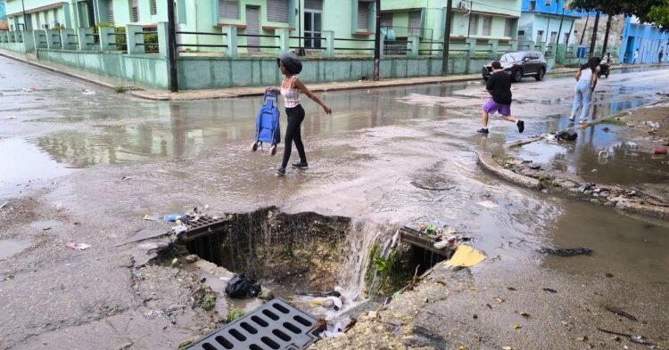 Photo of the day: A huge pothole becomes a waterfall and a trap for passers-by