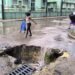Photo of the day: A huge pothole becomes a waterfall and a trap for passers-by