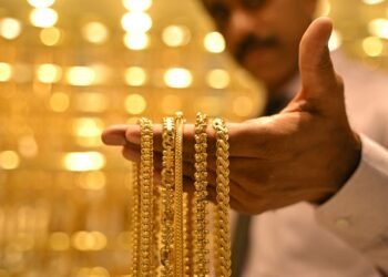 Gold slips as higher oil, US inflation data bolster Fed hike bets