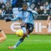 Shaw’s goal gives City share of spoils against Madrid